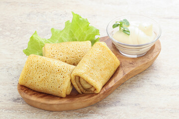 Stuffed pancakes with meat and cream