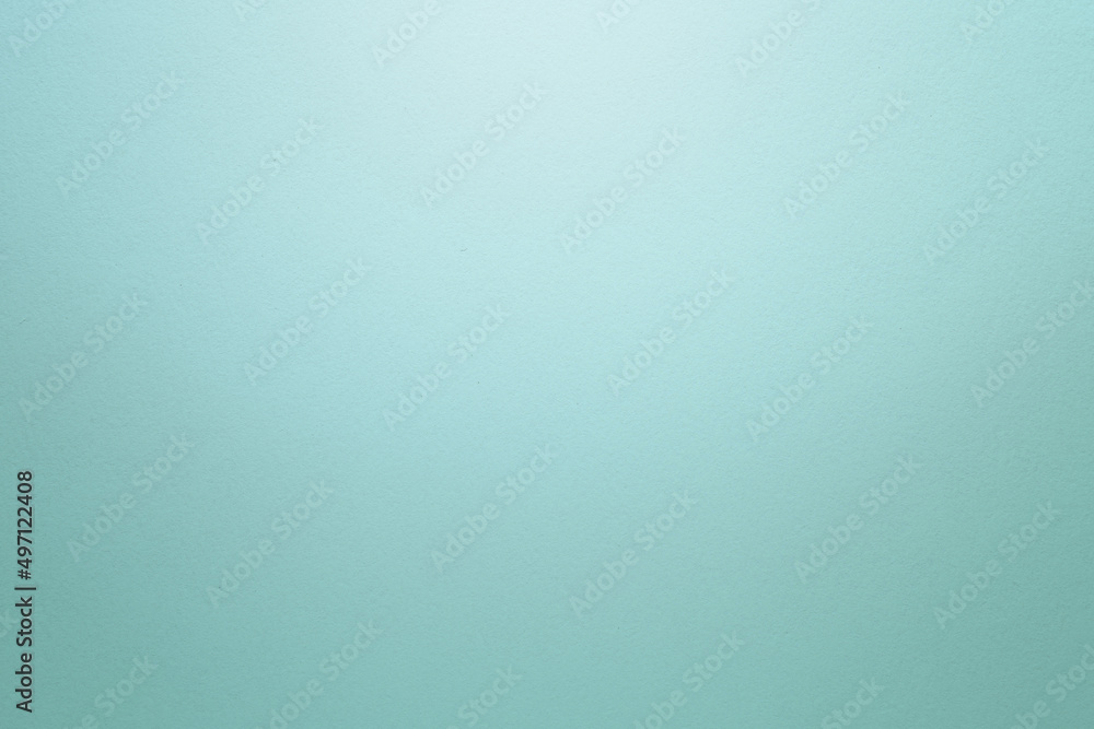 Aufkleber light turquoise textured paper background with light effect. copy space.