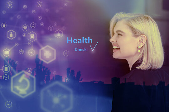 The concept of a digital medical examination with a hologram, where a blonde businesswoman smiles at her good health
