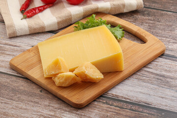 Parmesan hard cheese with small pieces