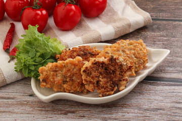 Fried salmonn cutlet in the bowl