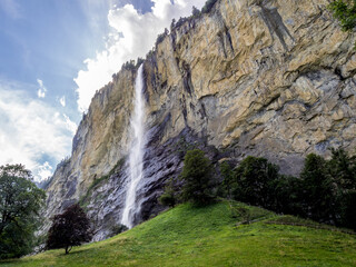 Staubbach waterfall in Lauterbrunnen village in Bernese Alps Switzerland - 497122684