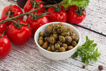 Marinated green capers in the bowl