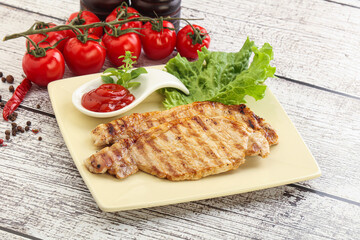 Grilled pork steak with ketchup