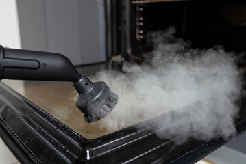 Steam cleaning of the oven. Cleaning in the kitchen.