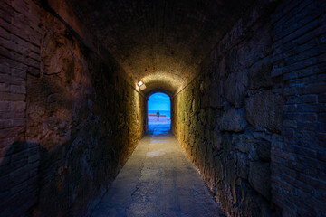Naklejka premium Old pedestrian tunnel with access to the Mediterranean Sea