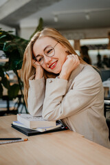 Young attractive woman smiling during remotely studying - 497126827