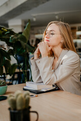 Young attractive woman thinking during remotely studying - 497126829