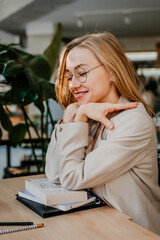 Young attractive woman smiling, studying concept - 497126833