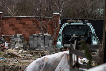 Fototapeta premium War in Ukraine. Damaged residential buildings. devastation in the yard.