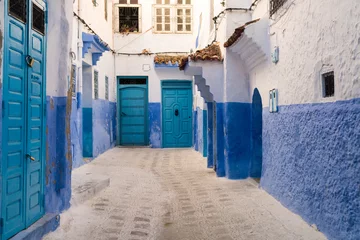 Zelfklevend Fotobehang Smal steegje Morocco, Chefchaouen, Narrow alley and traditional blue houses
