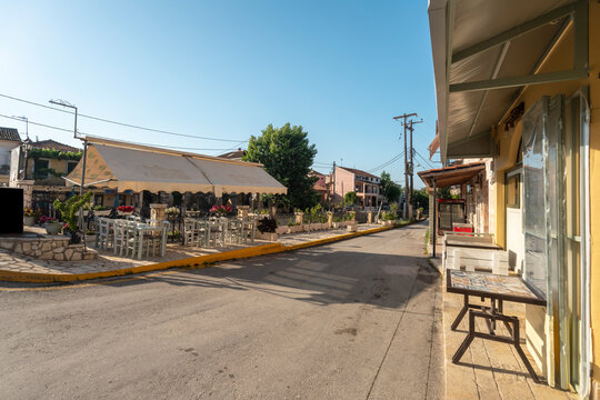 Greece, Lefkimmi, Empty sidewalk cafe and street