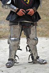 Metal armor to protect the legs of a medieval knight. Knight's clothing for historical...