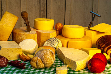 Different types of cheeses displayed on a typical Italian table, with special cutters for each type of cheese