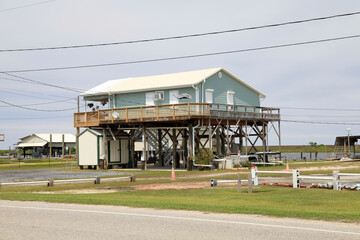Obraz premium Schutz vor Sturmfluten in Louisiana. Grand Caillou Road, Boudreaux, Louisiana, USA -- Protection from storm surges in Louisiana. Grand Caillou Rd, Boudreaux, Louisiana, USA 