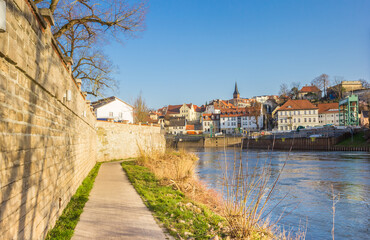 Fototapeta na wymiar Walking path along the river bank of the Saale river in Bernburg, Germany