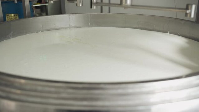 Whey for cheese production. Tank with whey. Cheese production technology.