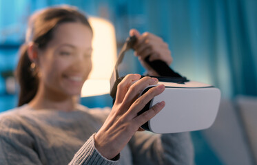 Smiling young woman wearing a VR headset