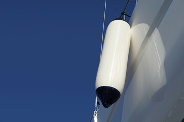 Side fender on a yacht on a dry dock outside the sea