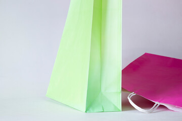 Paper shopping bags in the store on a white background. Paper bags.