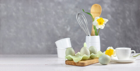Kitchenware. Easter background. Easter. Flowers and eggs. Banner. copy space