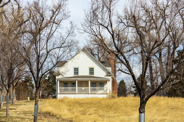 Beautiful early spring landscape with an abandoned house in the small neighborhood Fly'n B Park in Highland Ranch, Colorado