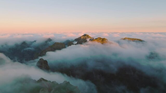 Top view of the third mountain on Madeira isalnd. Drone flight of the moutains in the morning light. Foggy morning on Madeira. Madeira, Portugal