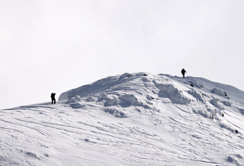 Group of alpinists trekking in harsh winter conditions in the Transylvanian Alps, Romania, Europe