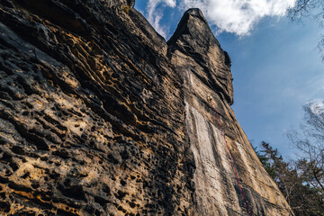 Epic sport climbing on giant sandstone cliffs of Elbe sandstone towers. Adventorous traditional Czech climbing on Sandstone.