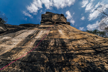 Epic sport climbing on giant sandstone cliffs of Elbe sandstone towers. Adventorous traditional Czech climbing on Sandstone.