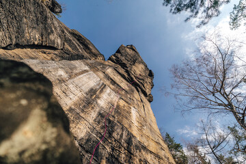 Epic sport climbing on giant sandstone cliffs of Elbe sandstone towers. Adventorous traditional Czech climbing on Sandstone.
