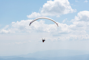 Paragliding on the background of the sky and mountains.