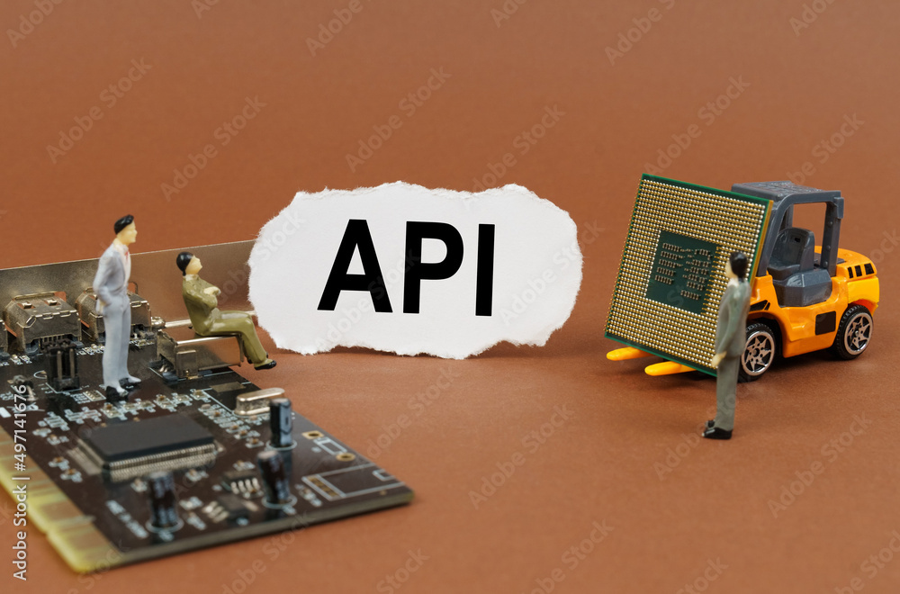 Poster On a brown background, a loader, a processor, a microcircuit, figures of people and paper with the inscription - API