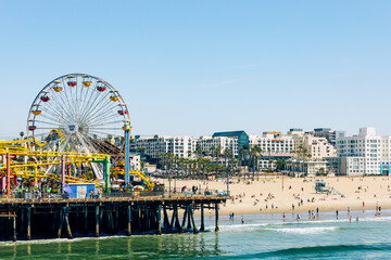 The Ferris Wheel at Santa Monica Pier. Popular tourist destination in Los Angeles. California. USA. - obrazy, fototapety, plakaty
