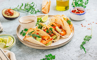 Diet healthy tacos with shrimps and avocado.