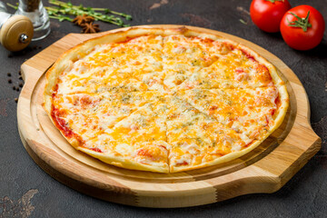 Pizza Quattro formaggi on dark concrete table