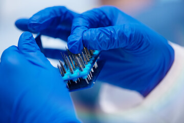 Nurse preparing tools for dentist