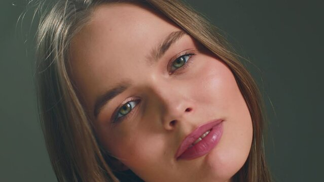 Alluring young girl with perfect makeup, healthy smooth skin, closeup. Skincare and make up cosmetics ad. ProRes codec