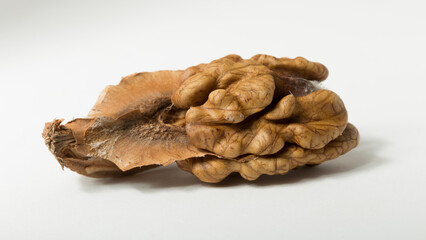 Walnuts are rounded, single-seeded stone fruits of the walnut tree. Walnut kernel and partitions.