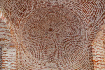 The ceiling of the mosque is made of red brick