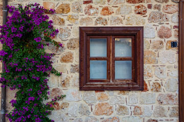 Fototapeta na wymiar Beautiful window of a vintage house in the old town of Side