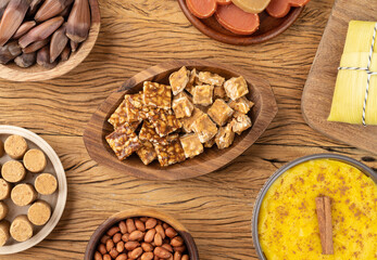 Typical brazilian june festival food over wooden table. Festa junina