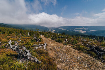 Krkonose National Park in spring. Mountain landscape of Giant moutains, Bohemia. Mountain meadows, peaks and forest of Krkonose mountains, Czechia.
