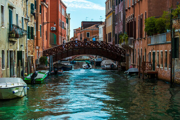 Fototapeta na wymiar VENICE, ITALY - August 28, 2021: View of tourists on bridge over Venice canals in Italy