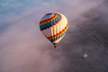 Fototapeta na wymiar Hot air ballons flying over Cappadocia National Park Goreme Turkey