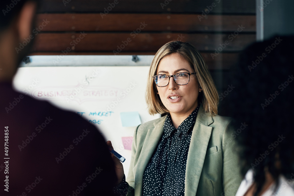 Fototapete Find out and feedback. Shot of a group of colleagues having a brainstorming session in a modern office.