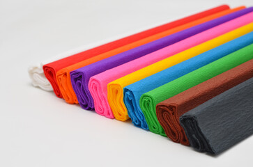 rolls of crepe paper for creativity on a white background close-up