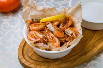 Tiger prawns on the grill with lemon