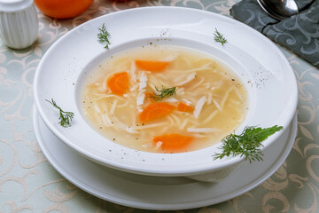 Chicken soup bouillon in a plate