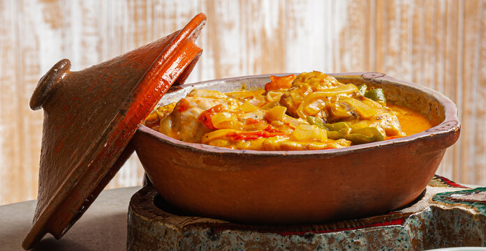 Grouper moqueca served with saffron rice, farofa and pir&atilde;o and pepper sauce. Typical Brazilian food